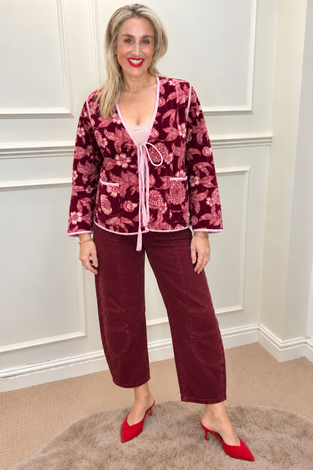 Maison de Belle Tie Front Velvet Jacket in burgundy floral velvet with pink ties, worn with burgundy barrel jeans and red heels