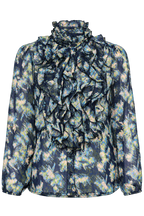 Front product view of the Lilja Blouse in Big Dipper Camo, showing a blue patterned fabric, layered ruffles and long sleeves.