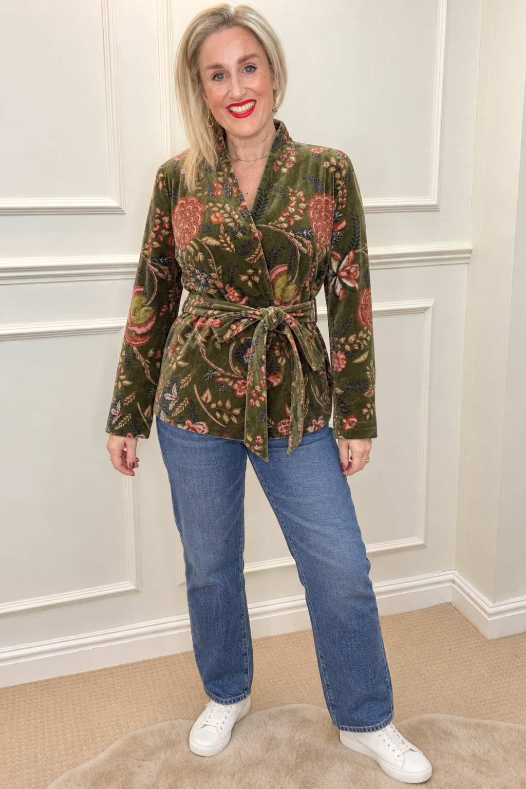 Maison de Belle Andy Velvet Jacket in moss green floral, tied at the waist, worn with straight jeans and white trainers