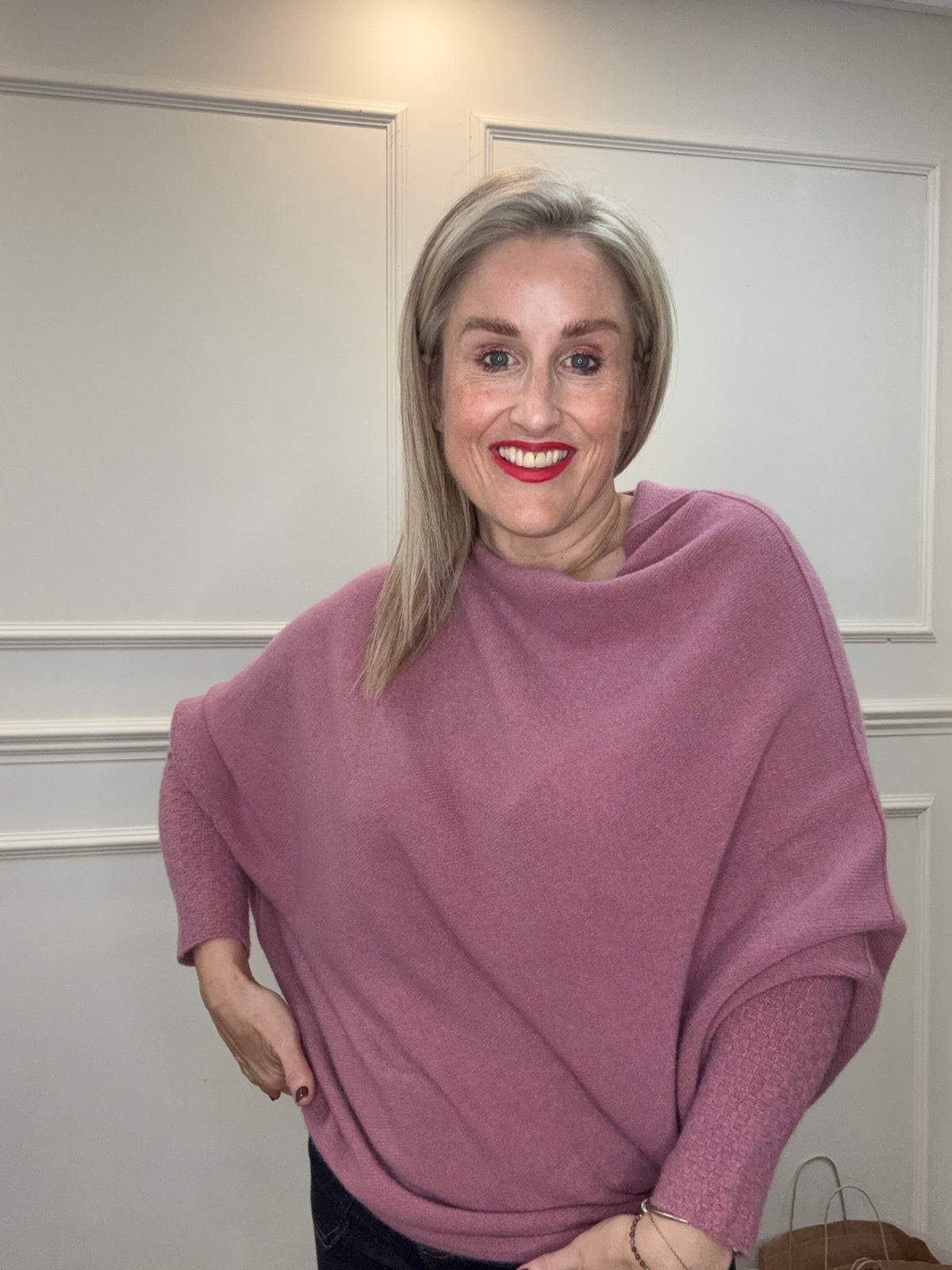 Asymmetric Knit in Cherry Yogurt worn as a cowl neck, showing the fluid drape