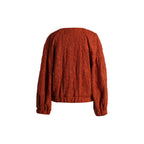 Emelia Jacket in Burnt Orange, back view showing the all-over embroidery