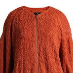Emelia Jacket in Burnt Orange, close-up of the raised tone-on-tone embroidery and brass zip