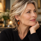 Woman aged over 50 wearing Walnut and Black Oval Twin Gem earrings with black knitwear
