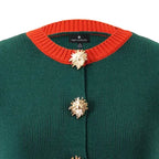 Teri Waistcoat, close-up of the gold sunburst button and burnt orange ribbed neckline