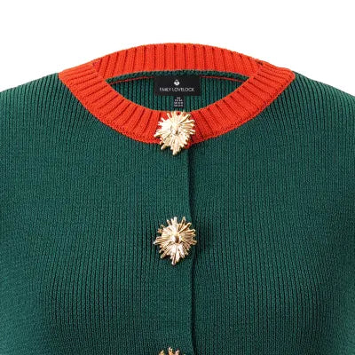 Teri Waistcoat, close-up of the gold sunburst button and burnt orange ribbed neckline